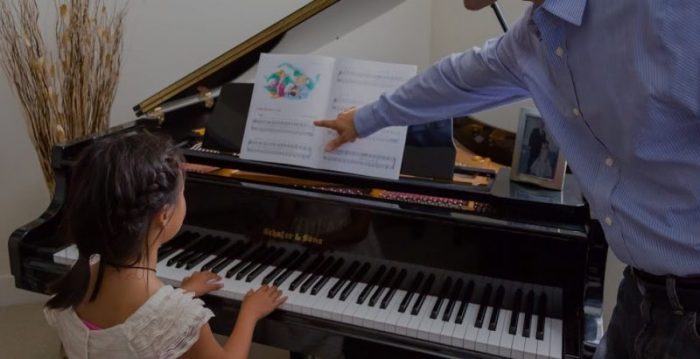 Learning piano playing at home with an instructor